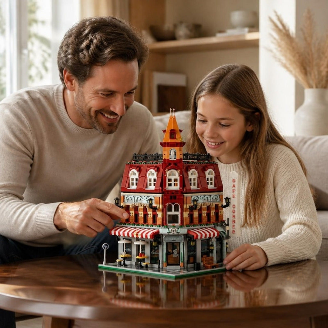 Father and daughter building the Corner Café set together at home