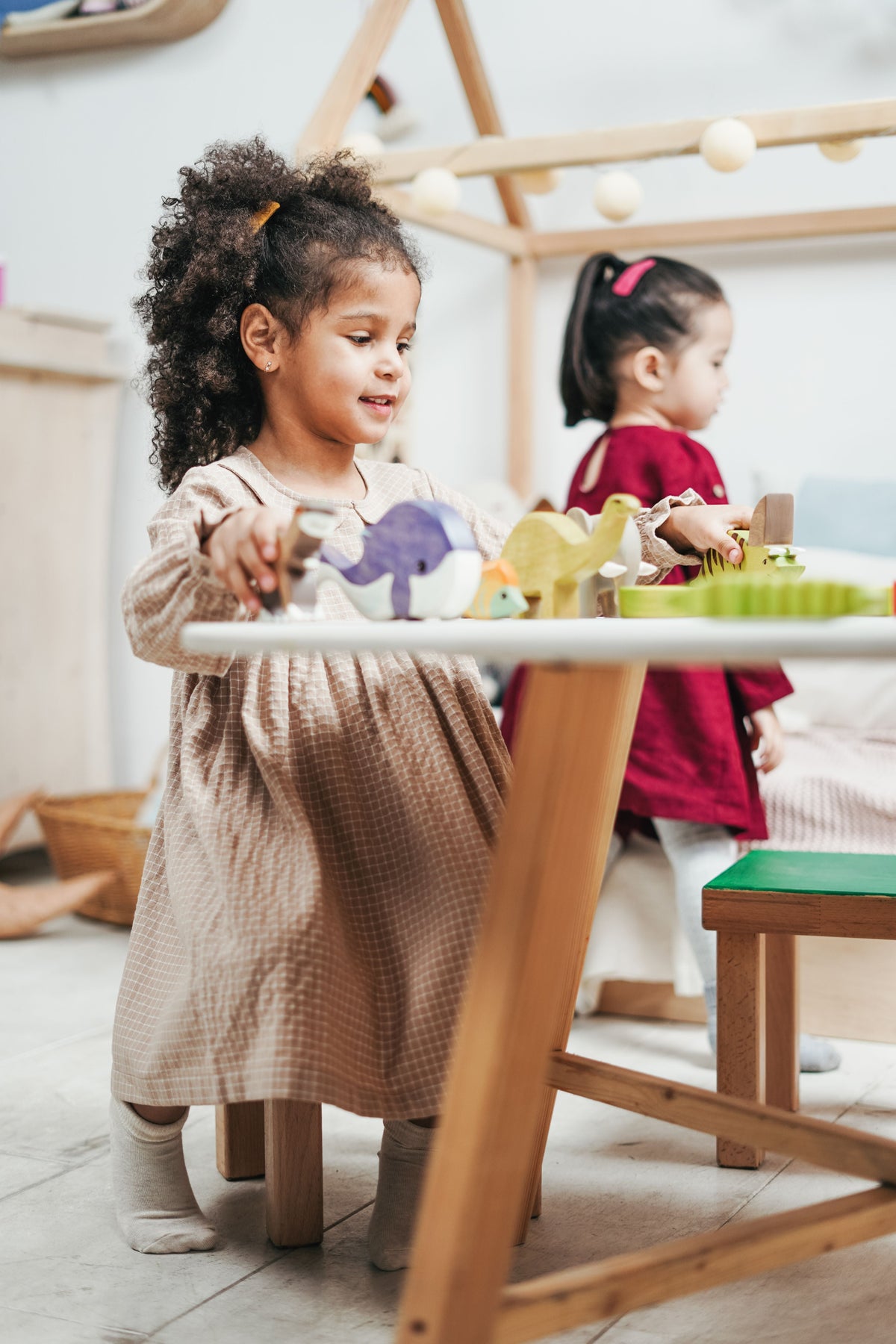 Kids playing with wooden building toys